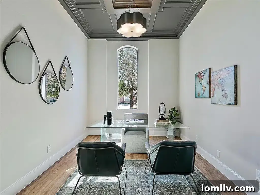 Grand entrance and renovated staircase, showcasing the open and airy feel of 704 Love Henry Court.