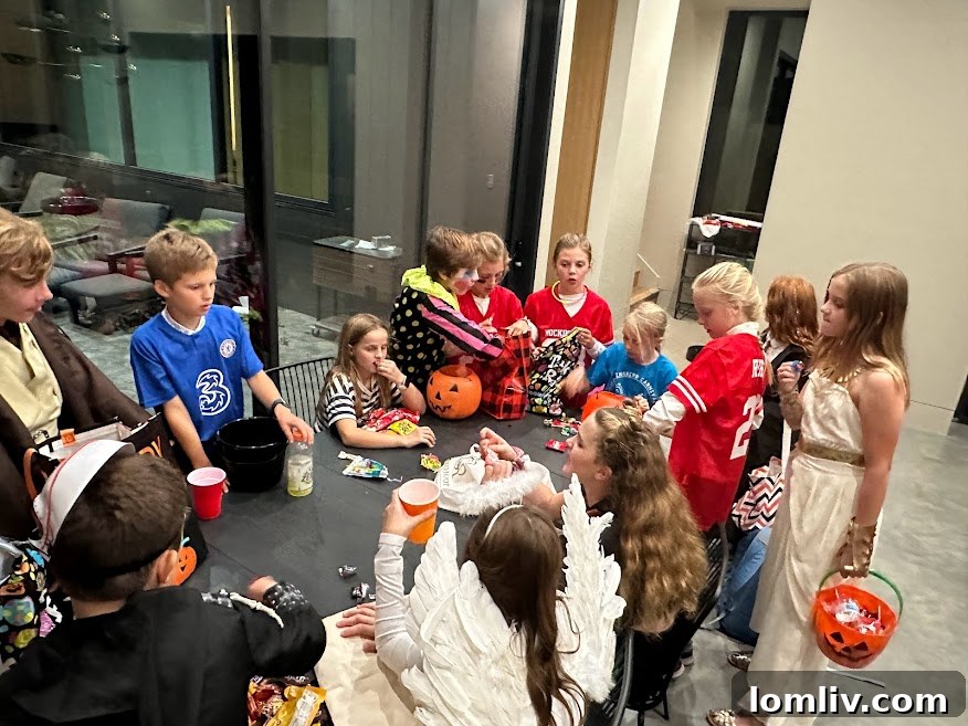 Children trading Halloween candy on the Thurmond patio in Dallas.