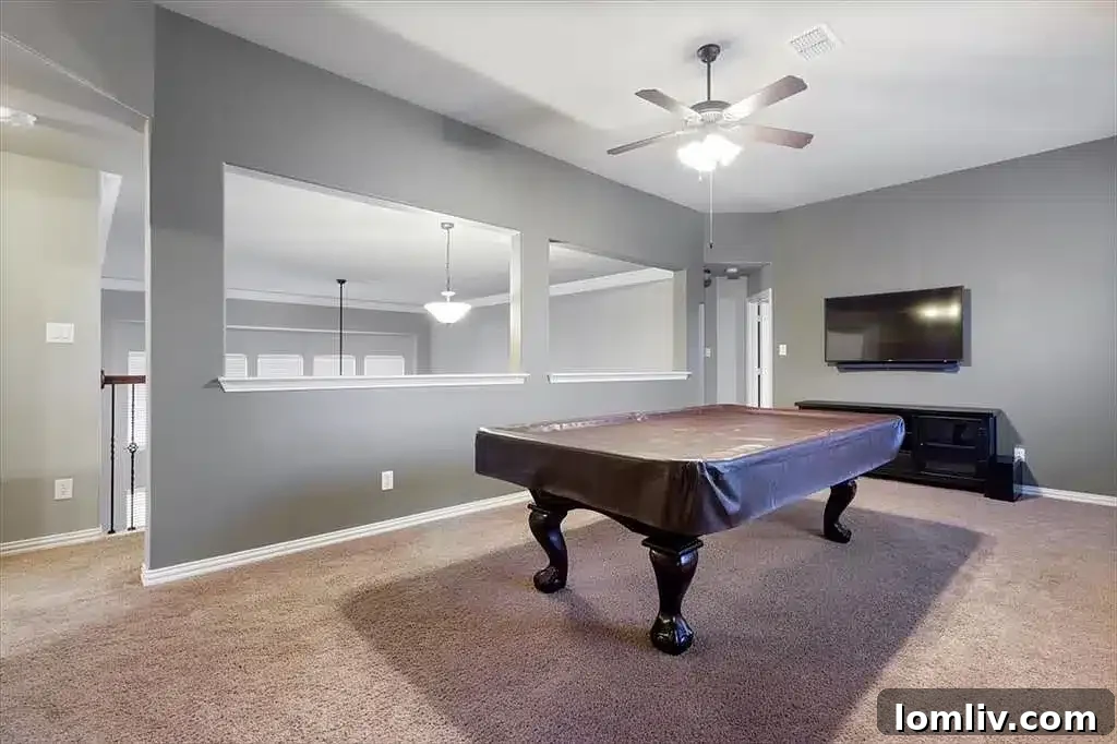 Close-up of the infinity pool and integrated spa with water features, highlighting backyard luxury