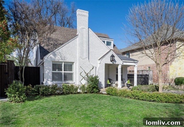 6251 Velasco, a brick Tudor home with a perfectly executed white exterior
