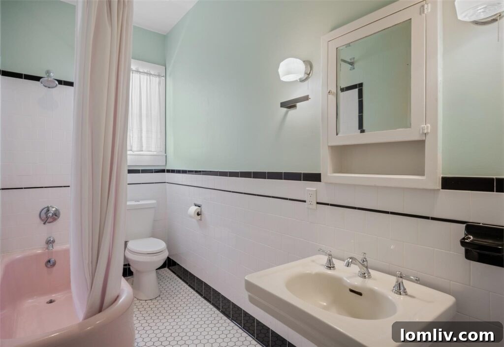 Bathroom with Vintage Pink Tub and Hex Tile