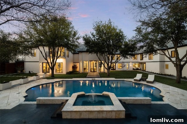 Expansive Backyard with Lush Landscaping and Sports Court