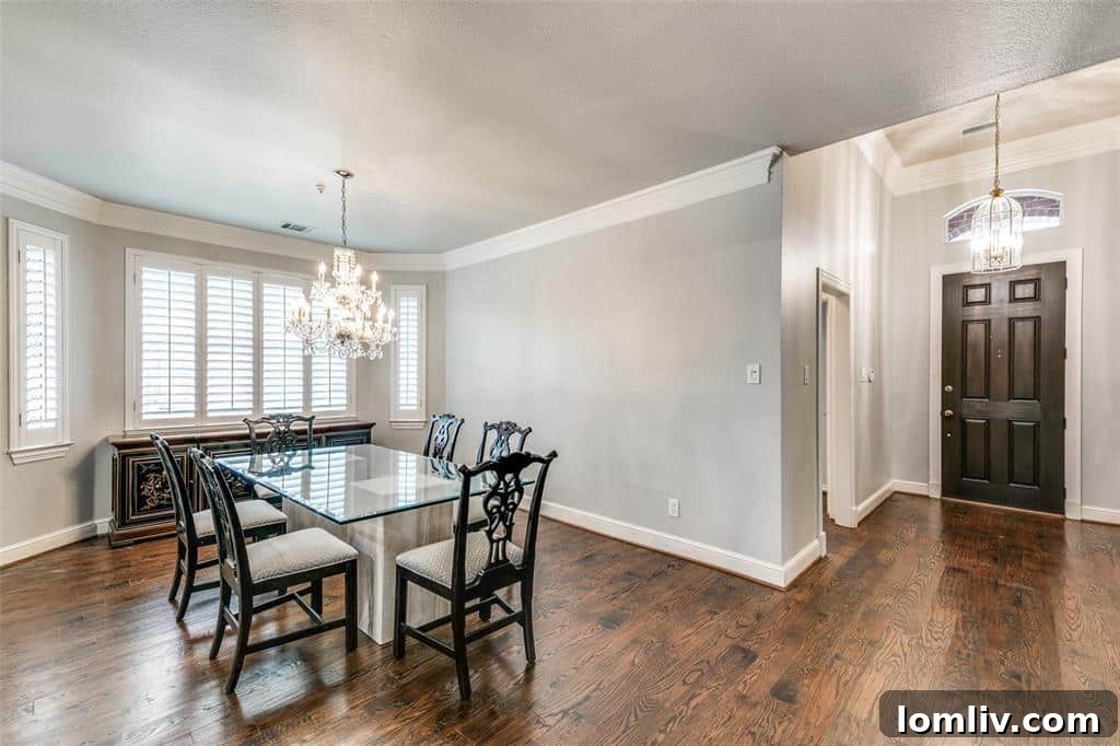 Spacious open-concept living and dining area in the updated Addison home.