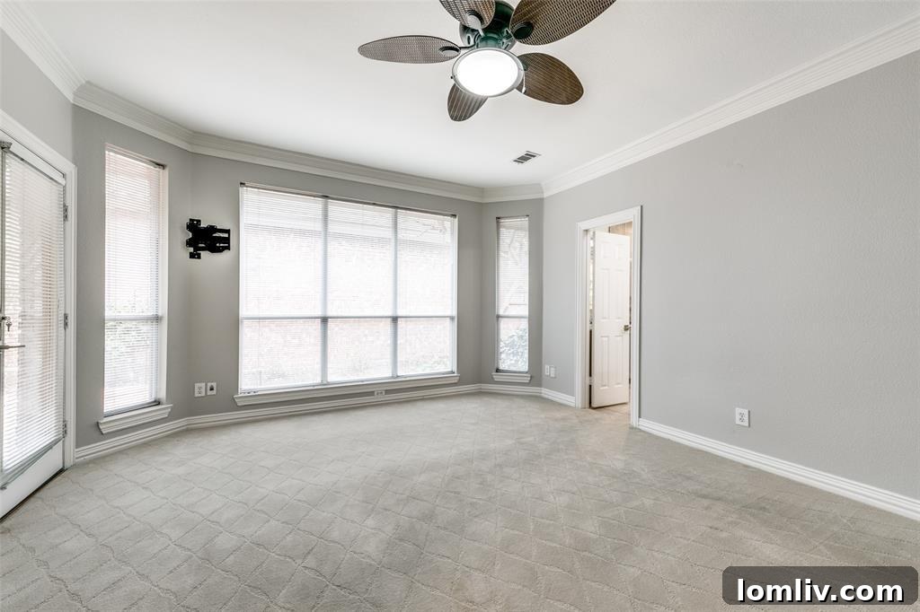 Luxurious owner's suite bedroom, spacious and well-lit.