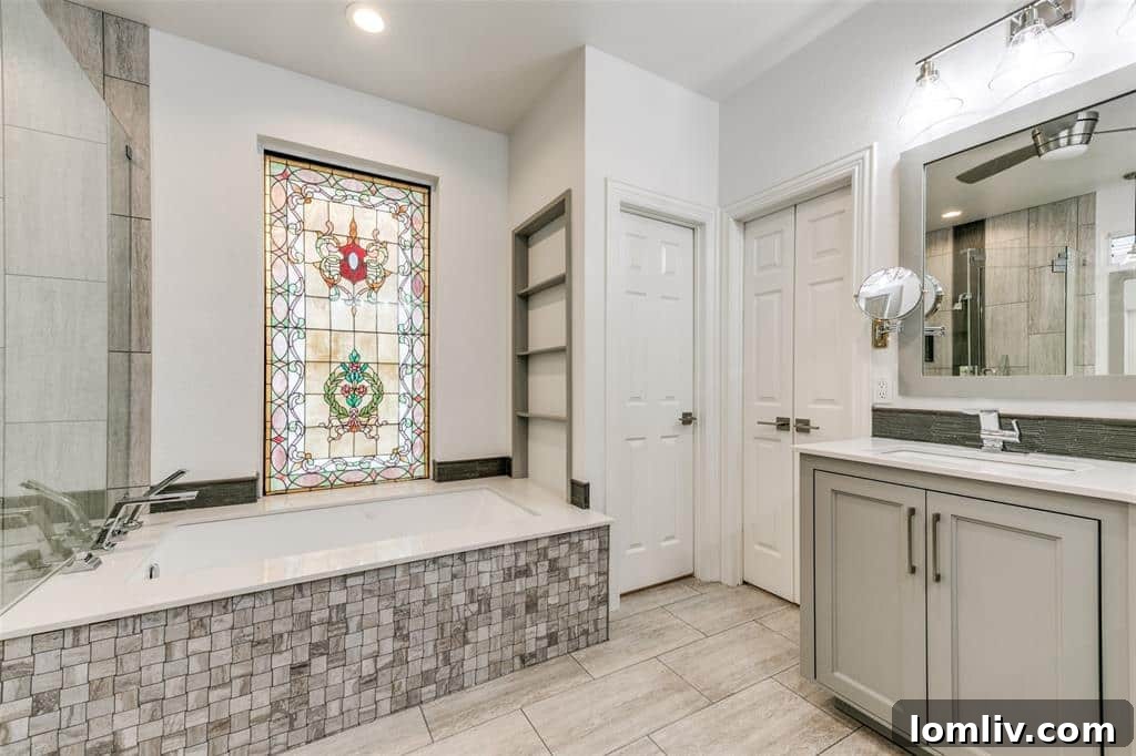 Spa-like en-suite bathroom with a freestanding tub and modern vanity.