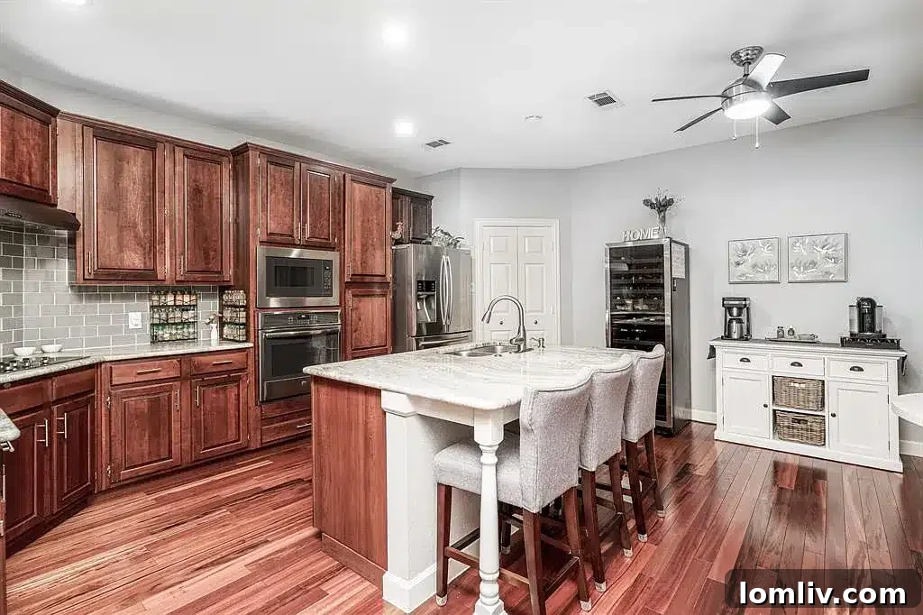 Dining area adjacent to the kitchen, featuring stylish lighting.
