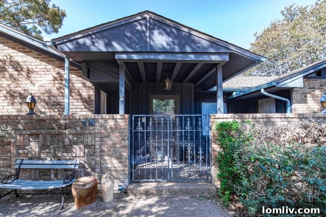The exterior of a custom 1970s home, showcasing unique architectural features and original design.
