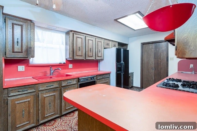Close-up of the distinctive red poppy wallpaper in the half-bath, a key original feature.