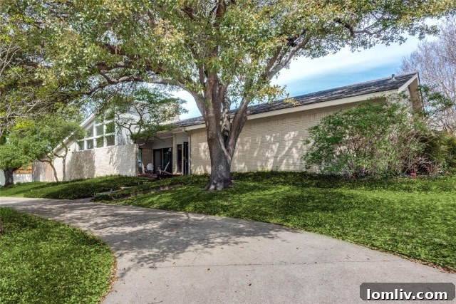 The inviting backyard features a sparkling pool and a spacious covered patio, perfect for entertaining in Merriman Park.