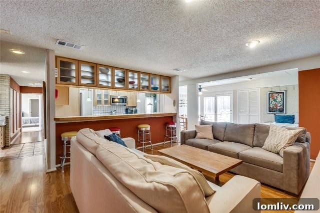A glimpse of the sun-drenched living area, showcasing the open floor plan and unique architectural details of the Merriman Park house.