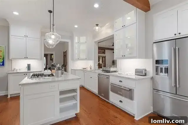 Experience North Texas: World-Class Porch Sitting Awaits at Open Houses 5 A stunning kitchen in a 1905 McKinney home, updated with modern appliances and finishes.