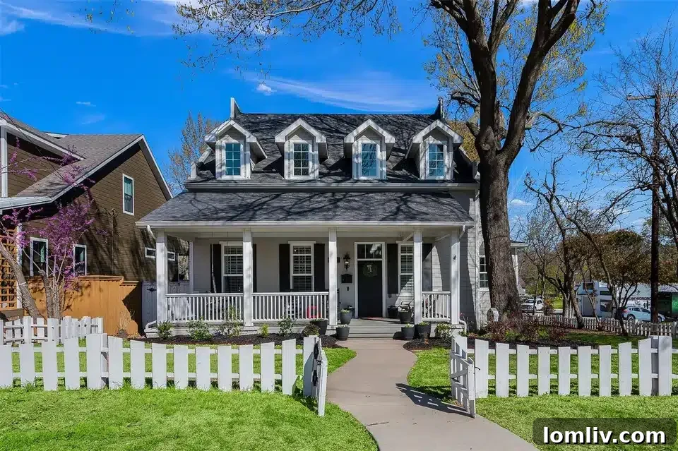 Experience North Texas: World-Class Porch Sitting Awaits at Open Houses 9 A picturesque home in McKinney with a white picket fence and inviting front porch, showcasing classic architectural details.