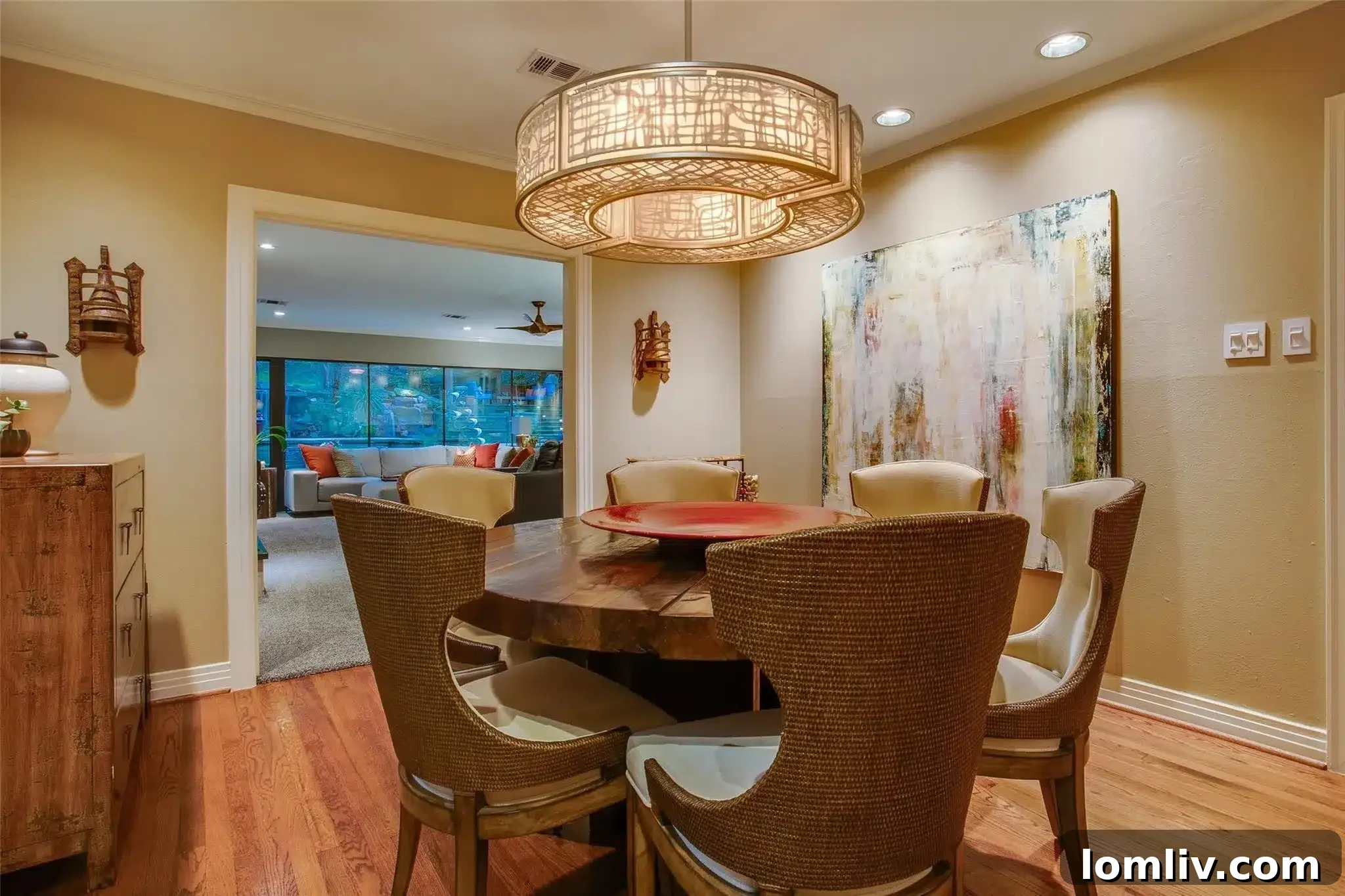 View of the house from the backyard, showcasing large windows and deck