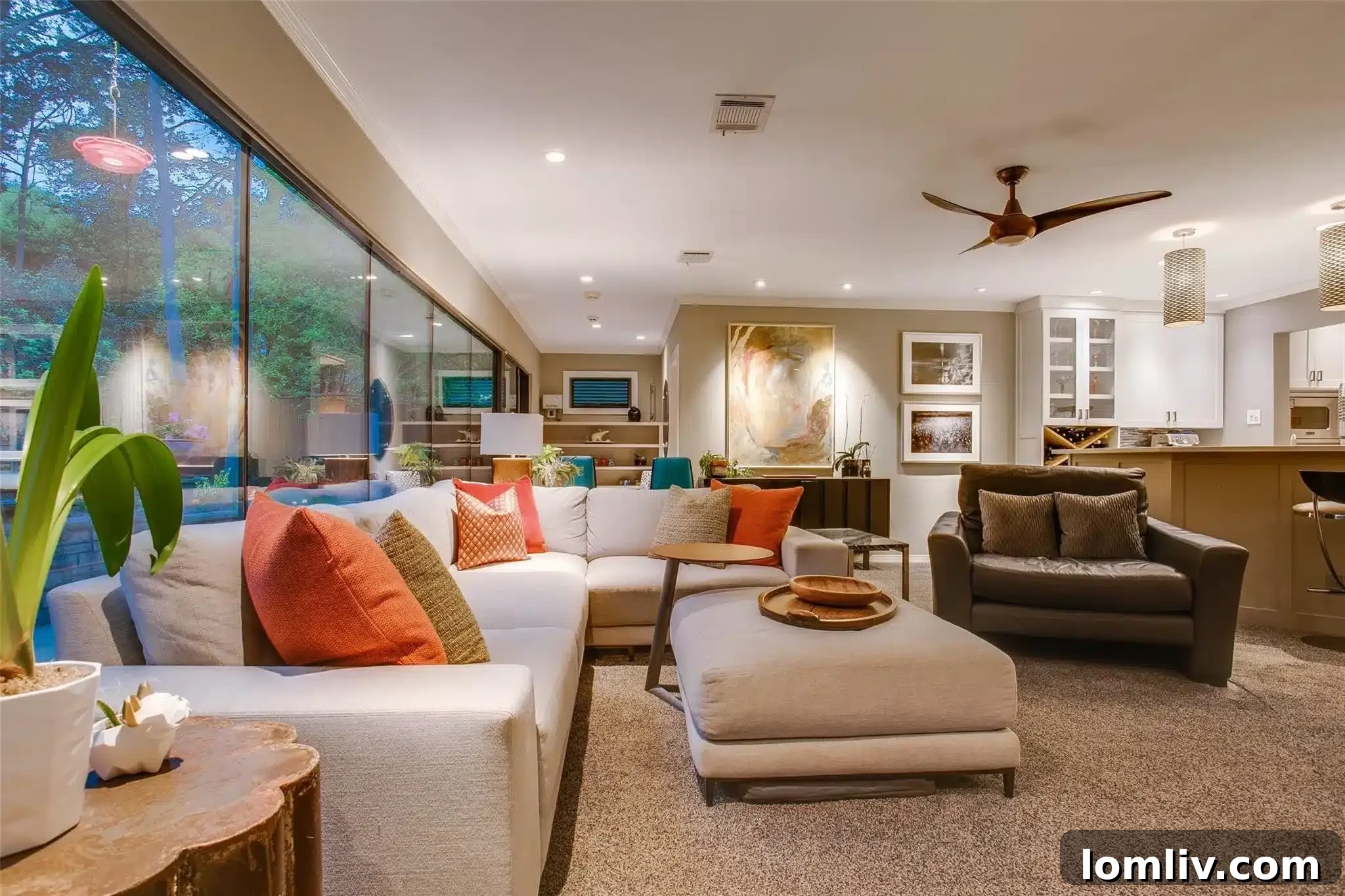 Overview of the entire outdoor entertainment space, including the pool and fireplace