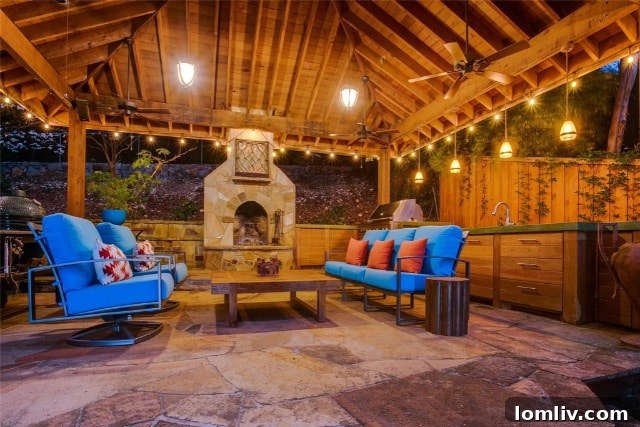 Cozy outdoor pergola with a fireplace, perfect for entertaining