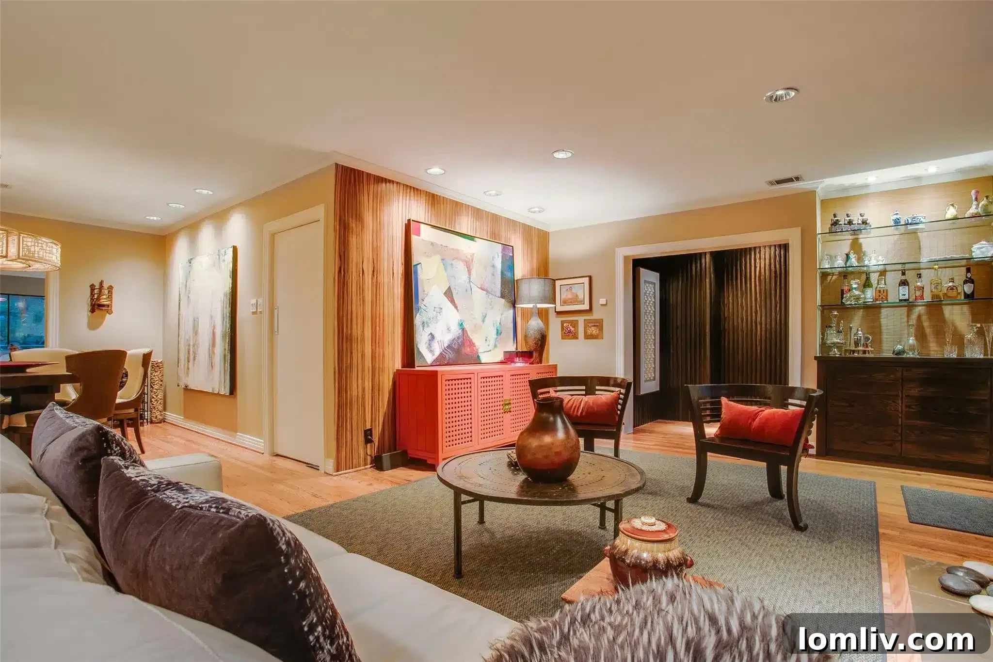 Another view of the multi-level backyard with pool and green landscaping