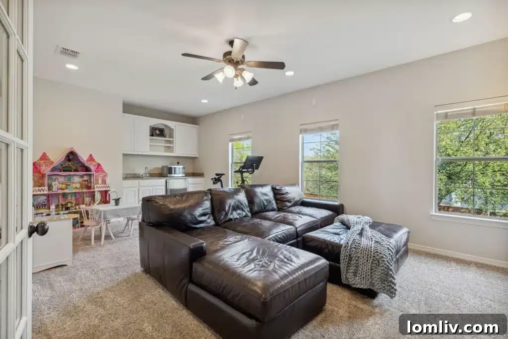 Upstairs entertainment room with wet bar and comfortable seating