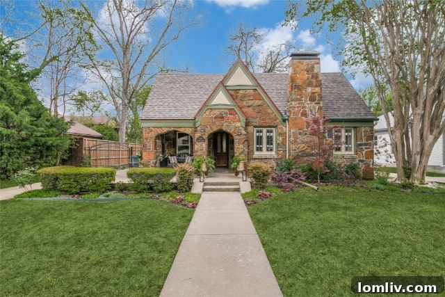 Charming Tudor home exterior with stone accents and lush landscaping