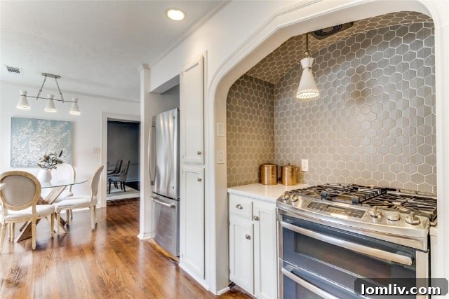 Elegant living room interior with a cozy fieldstone fireplace and neutral decor