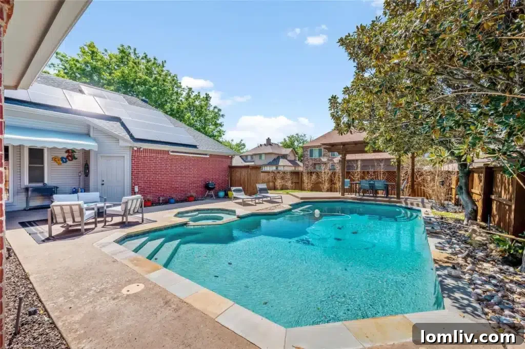 Backyard with a diving pool, heated spa, and outdoor dining area under a pergola