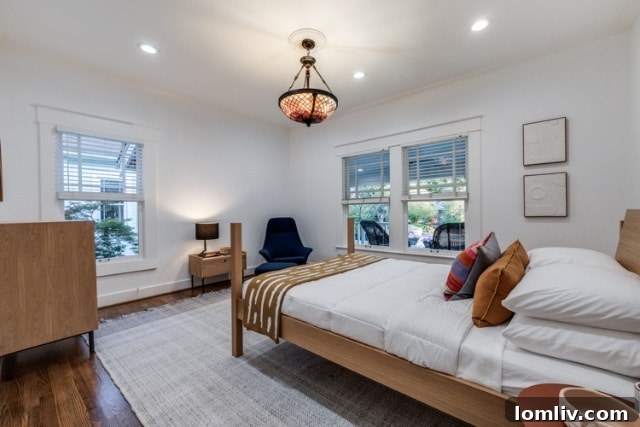 Spacious Kitchen Island with Seating and Contemporary Lighting