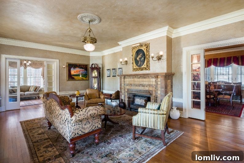 The stunning 100-year-old Prairie-style home of Gary and Vanessa Hoffman at 6017 Swiss Avenue, a featured property on the 2023 Swiss Avenue Mother’s Day Home Tour, showcasing its classic architecture and inviting porch.