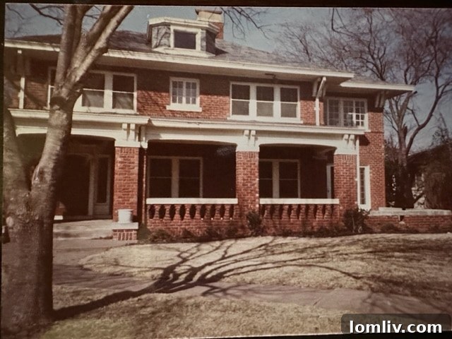 Exterior view of 6017 Swiss Avenue in 1985, showing its classic Prairie-style architecture with an inviting front porch, mature landscaping, and characteristic horizontal lines.