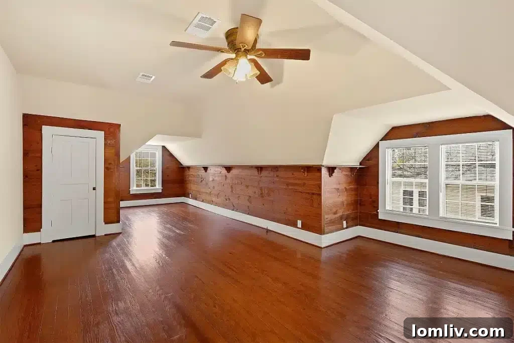 The grand staircase, a centerpiece of this Victorian home's interior.
