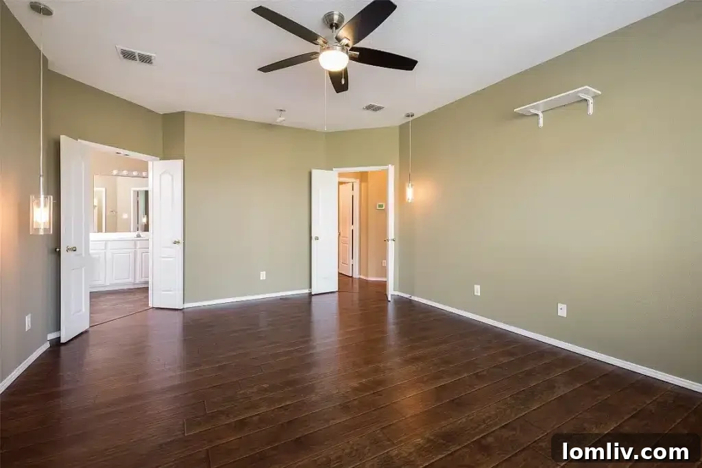 Primary bedroom on the ground floor, offering comfort and privacy.