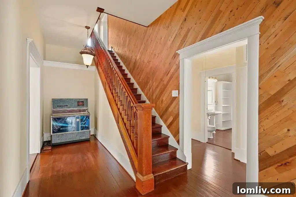Elegant Victorian dining room with intricate details and ample natural light.