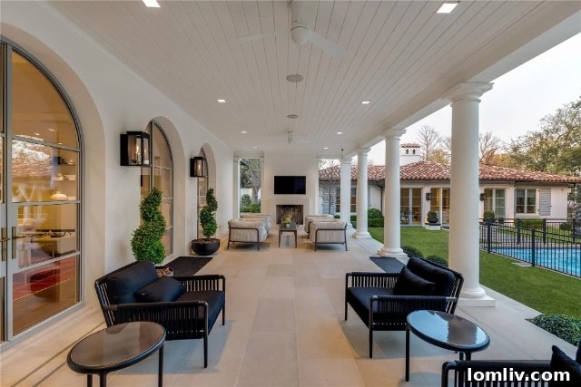 Serene view of the backyard pool area and impeccably landscaped garden, creating a private resort-like ambiance