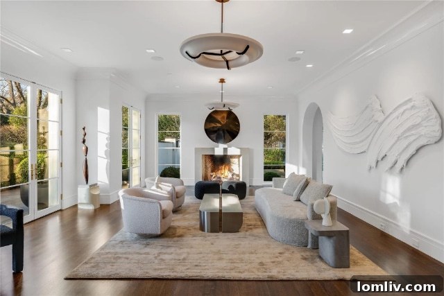 Modern kitchen with high-end Sub-Zero and Wolf appliances, minimalist cabinetry, and a spacious island in the luxury Santa Barbara villa