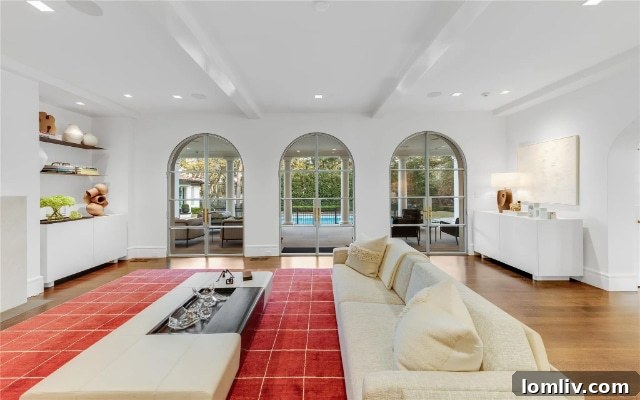 Inviting patio area with comfortable outdoor seating, a modern fire pit, and sophisticated landscaping perfect for entertaining