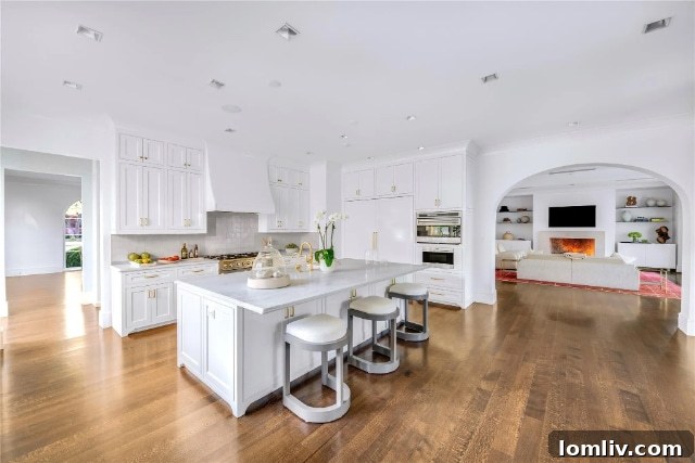 Stunning exterior facade of the modern Santa Barbara villa with clean lines, large windows, and manicured hedges