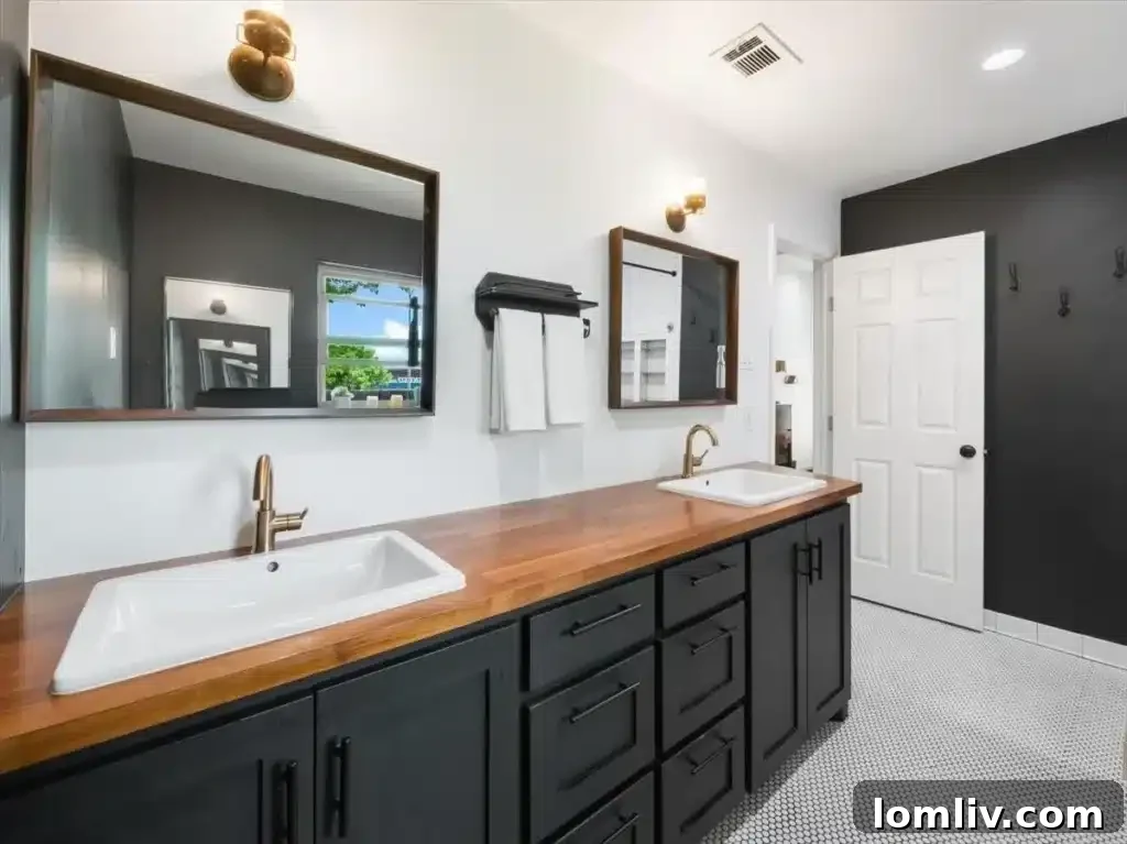 Stylish primary bathroom with dual vanity