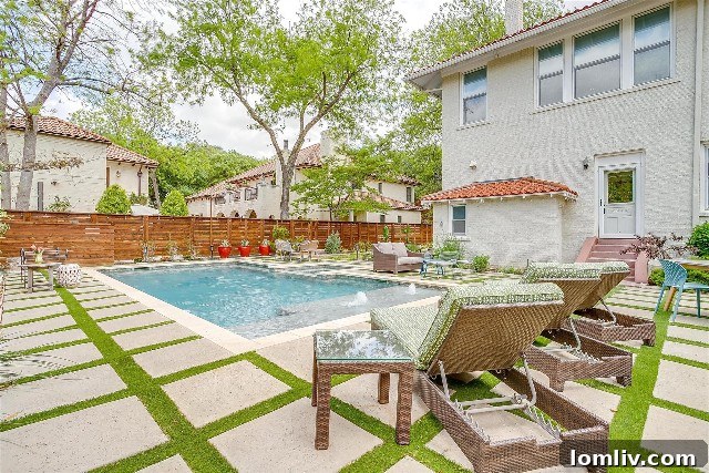 Luxury resort-style pool with outdoor entertaining area