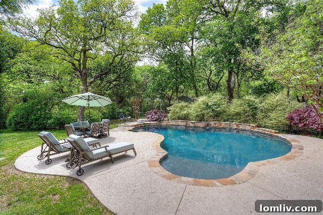 Secluded private swimming pool at 4132 Tamworth Road, completely enveloped by dense mature trees, creating an unparalleled sense of privacy and a serene escape.