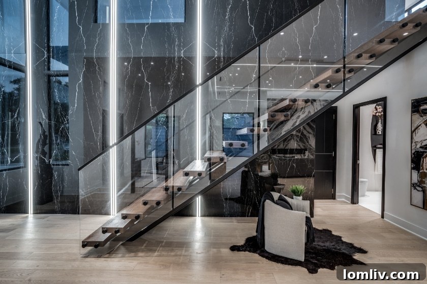 Elegant interior view of a contemporary living space designed by Janet Goldschmidt, showcasing open-plan layout and sophisticated finishes.
