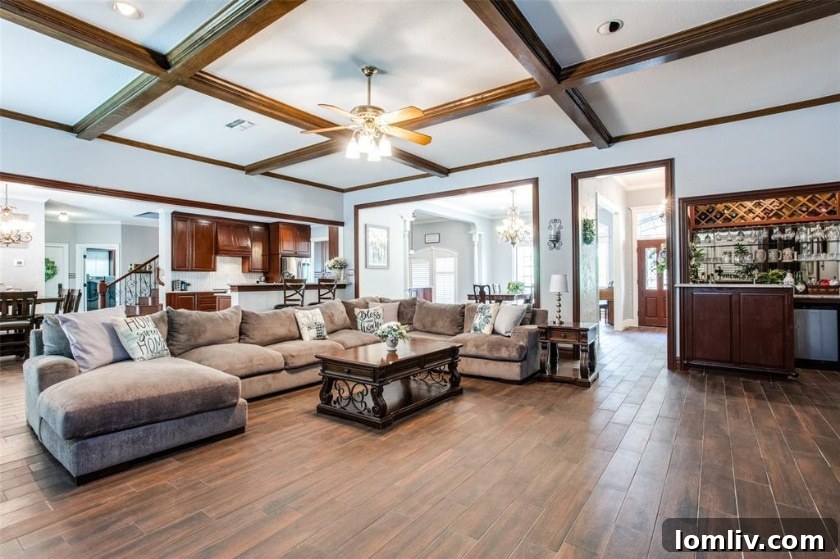 This Canyon Oaks Home: The Argyle Standard of Seamless Living 5 Spacious Family Room with Coffered Ceiling and Fireplace