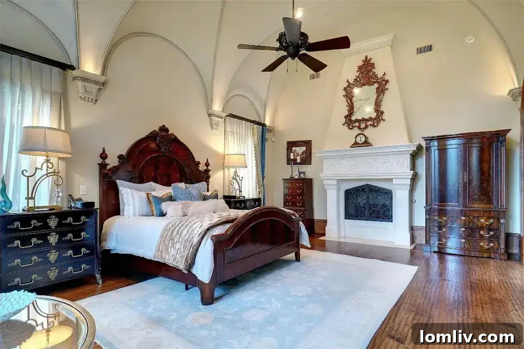 Colleyville Luxury: Homes That Redefine Grandeur 20 Opulent master suite with a private sitting area and fireplace at 5513 Montclair Drive