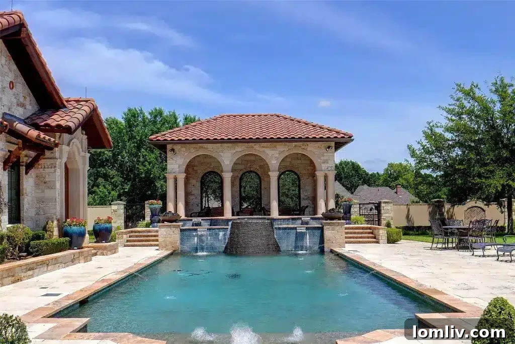 Colleyville Luxury: Homes That Redefine Grandeur 25 Expansive outdoor entertaining area next to the pool at 5513 Montclair Drive