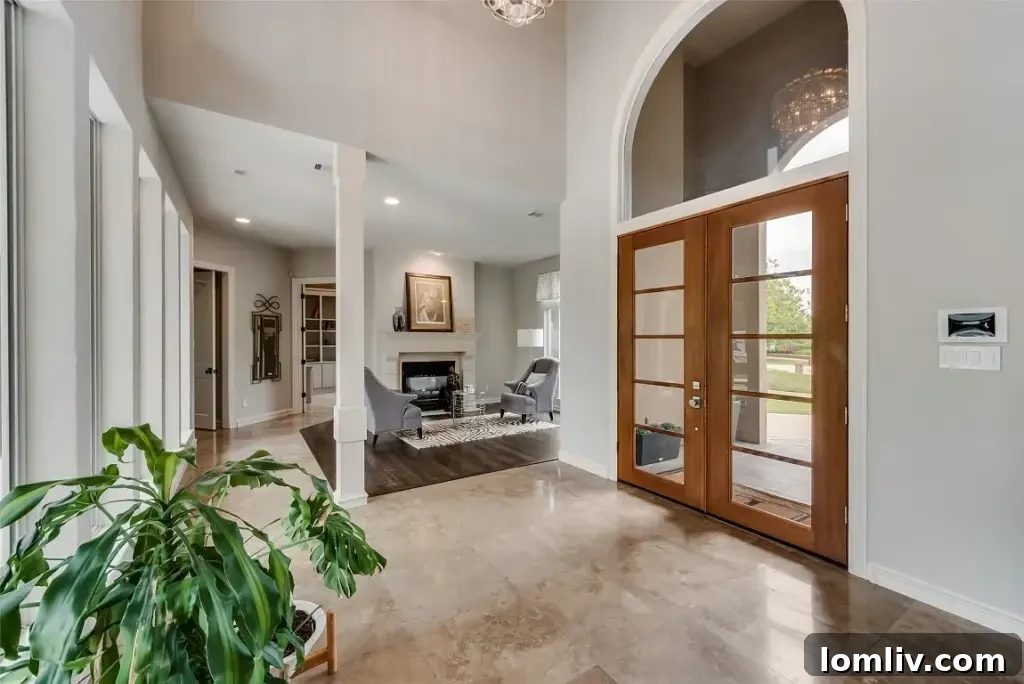 Colleyville Luxury: Homes That Redefine Grandeur 29 Spacious living room with high ceilings and views of the backyard at 3900 Saint James Court