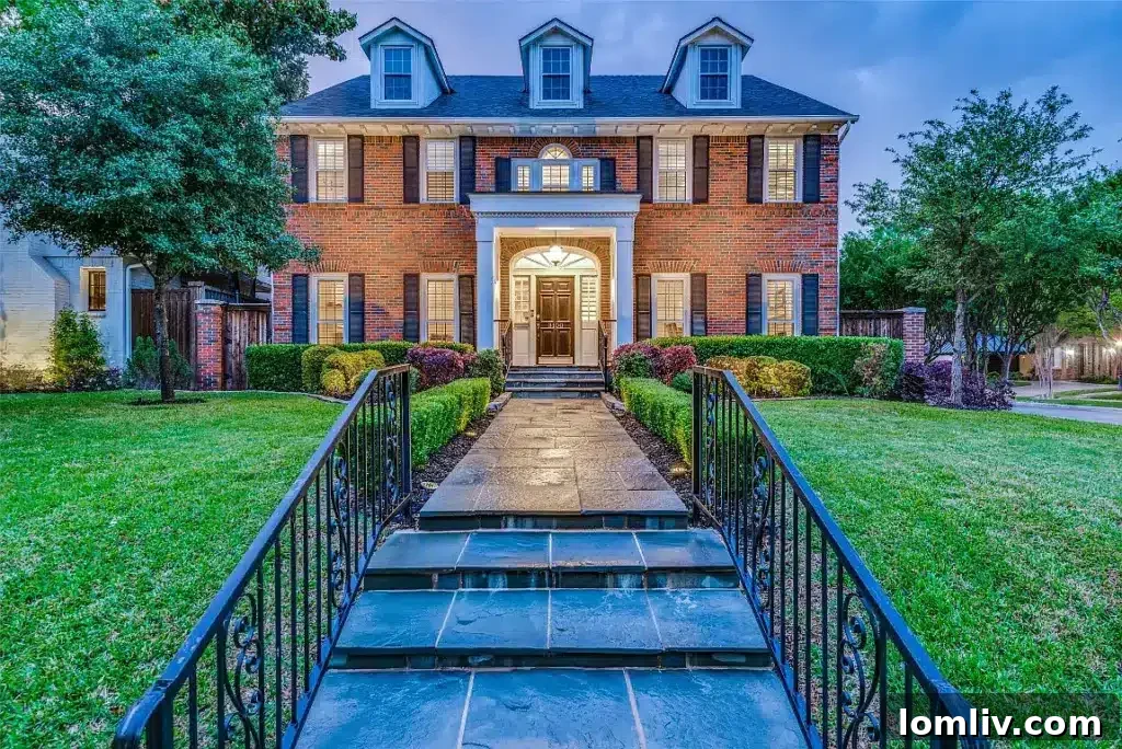 Elegant red brick Highland Park home with manicured landscaping