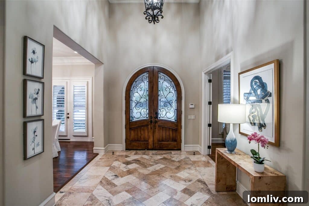 Elegant foyer with double-door entry in the JanMar Estates home