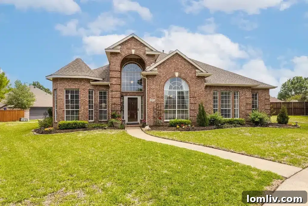Stunning Rowlett home at 6010 Arden Court, featuring beautiful landscaping and lakeside access