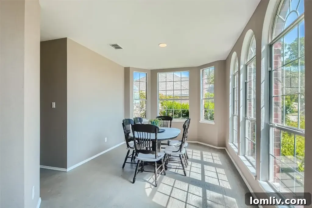 Bright and airy living room, perfect for entertaining in this large Rowlett house.