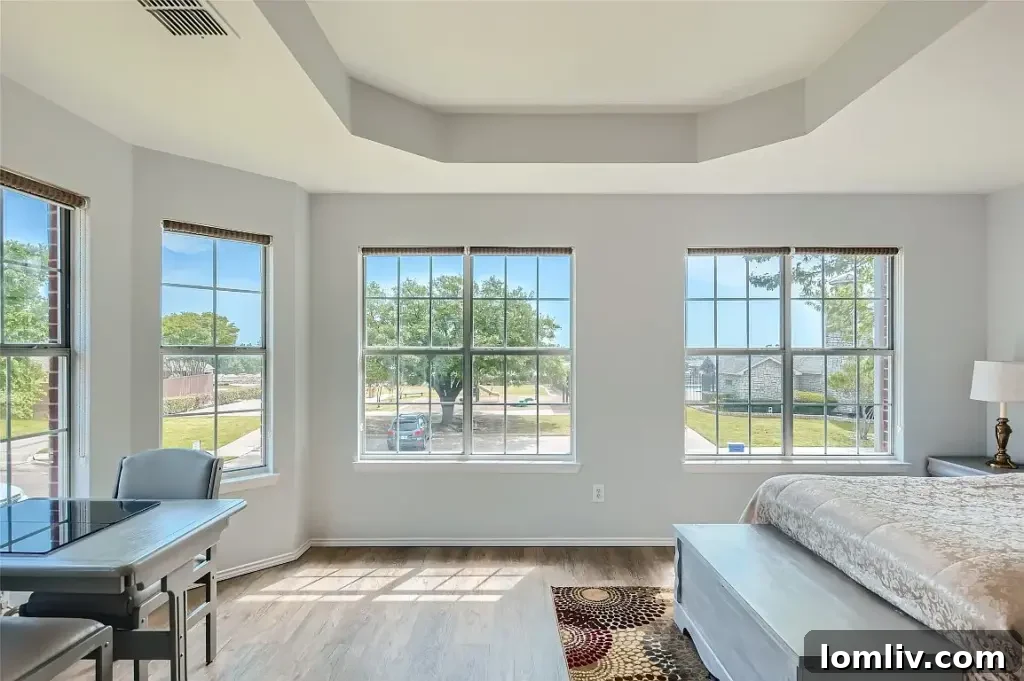 Spacious secondary bedroom, offering comfort and privacy in this Rowlett residence.