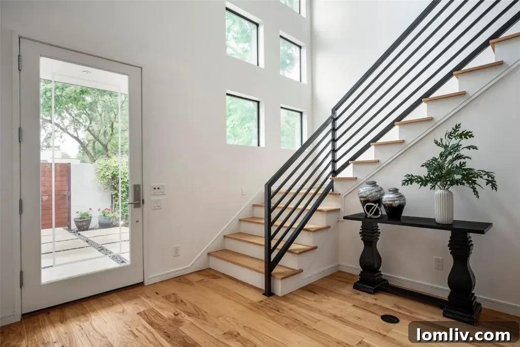 An interior view showcasing large windows flooding the home with light