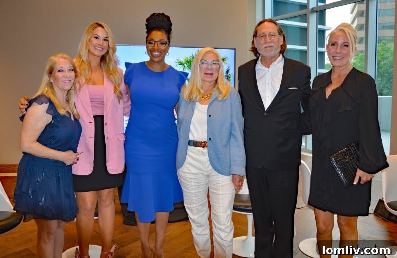 Event moderator Candy Evans engaging with the luxury real estate panel