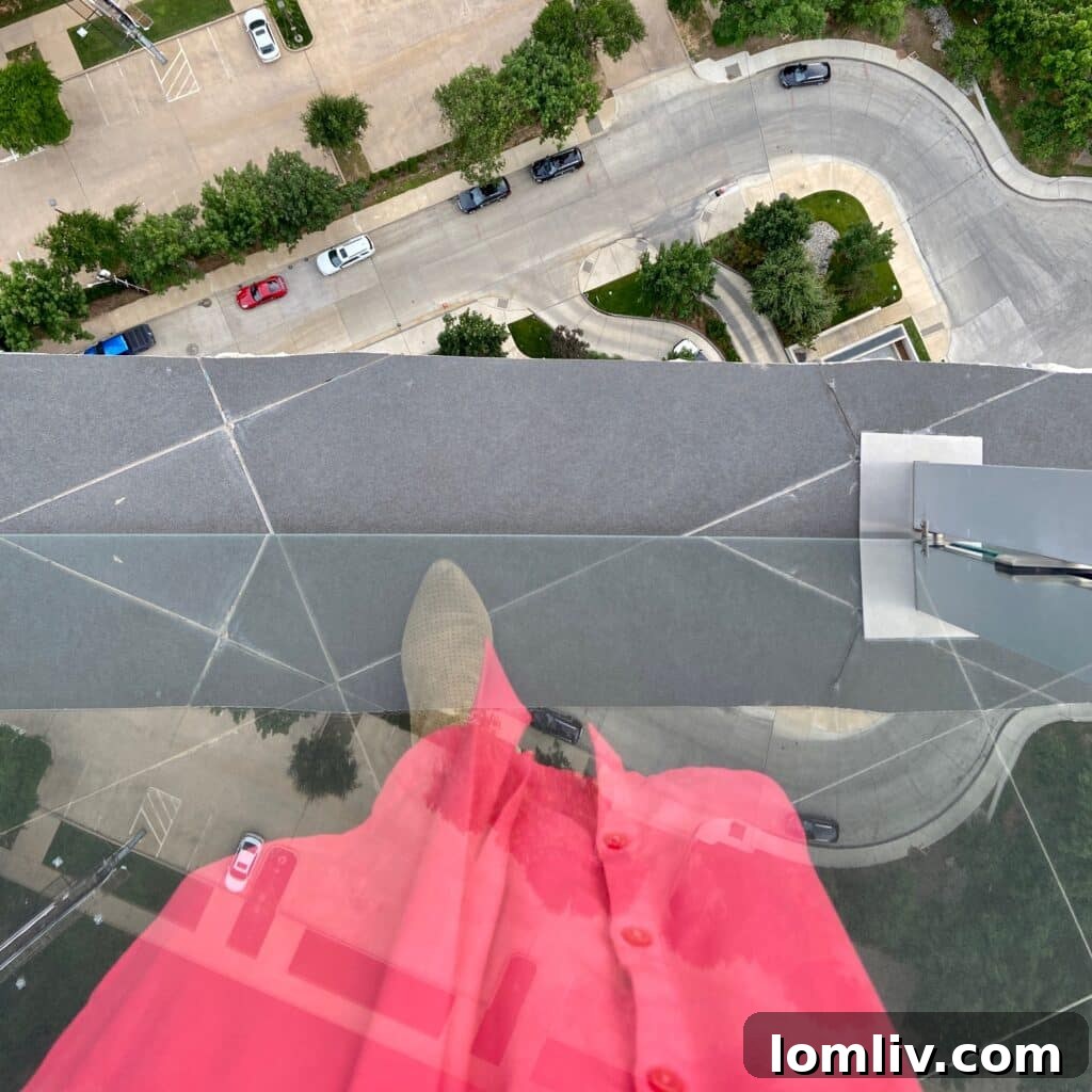 Stunning panoramic Dallas skyline view from a high-rise luxury condo balcony